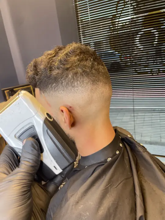 Men's haircut by Next Level Barbershop